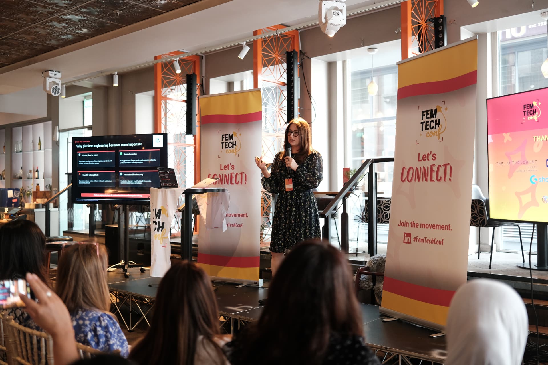 Speaker sharing insights on stage at the 2026 Women in Tech London Summit