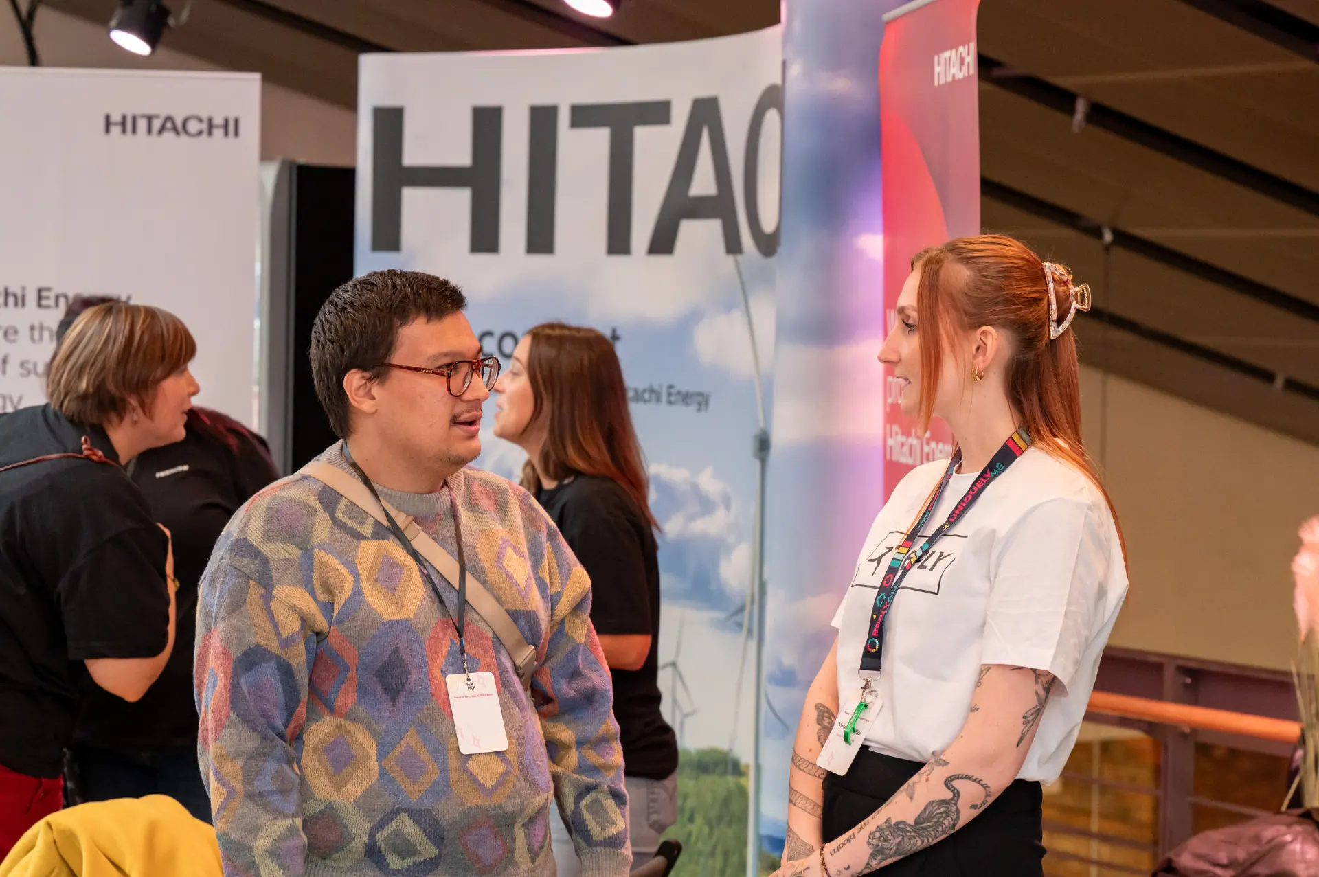 Attendees networking at a partner expo booth