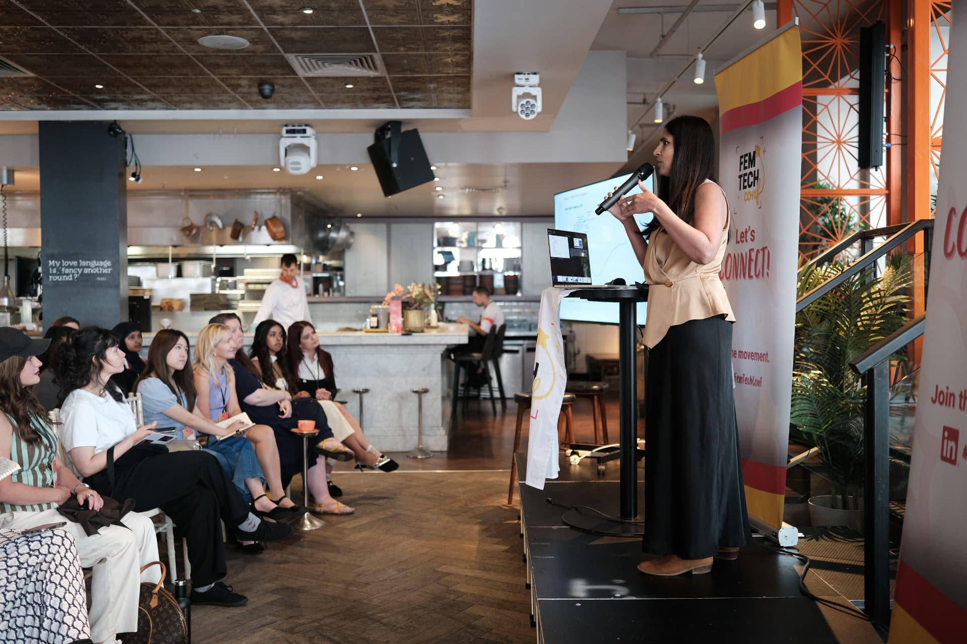 Speaker presenting to the audience at the 2026 Women in Tech London Summit