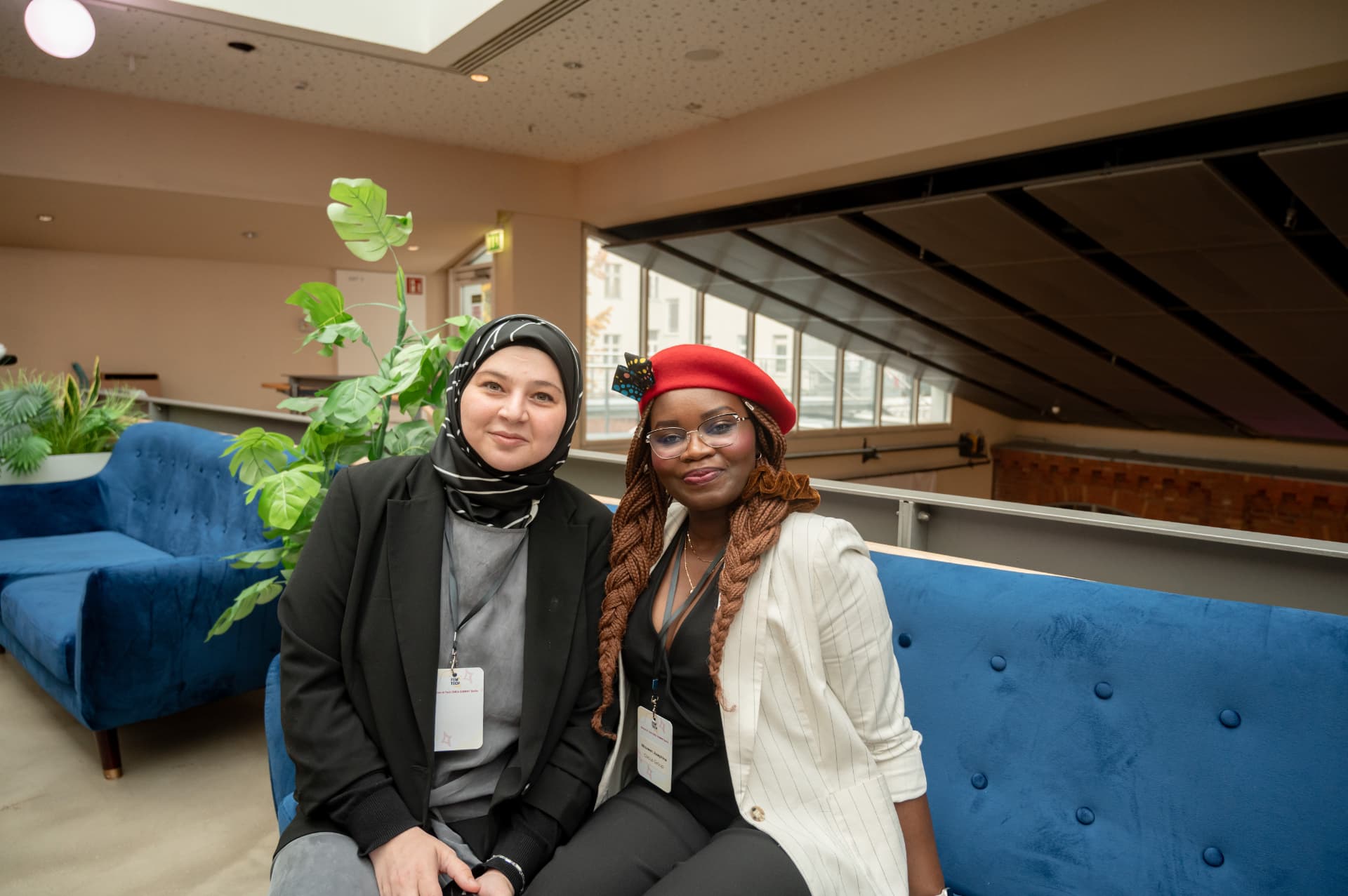 Two attendees in the summit lounge